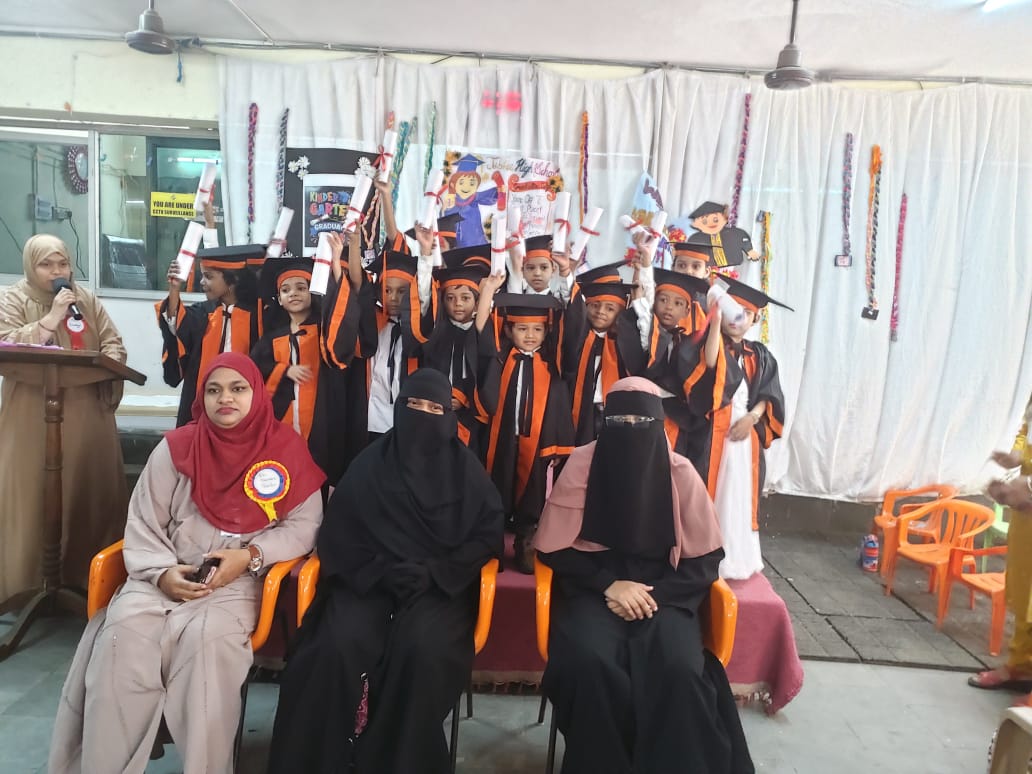 Kindergarten graduation day, caps and gowns